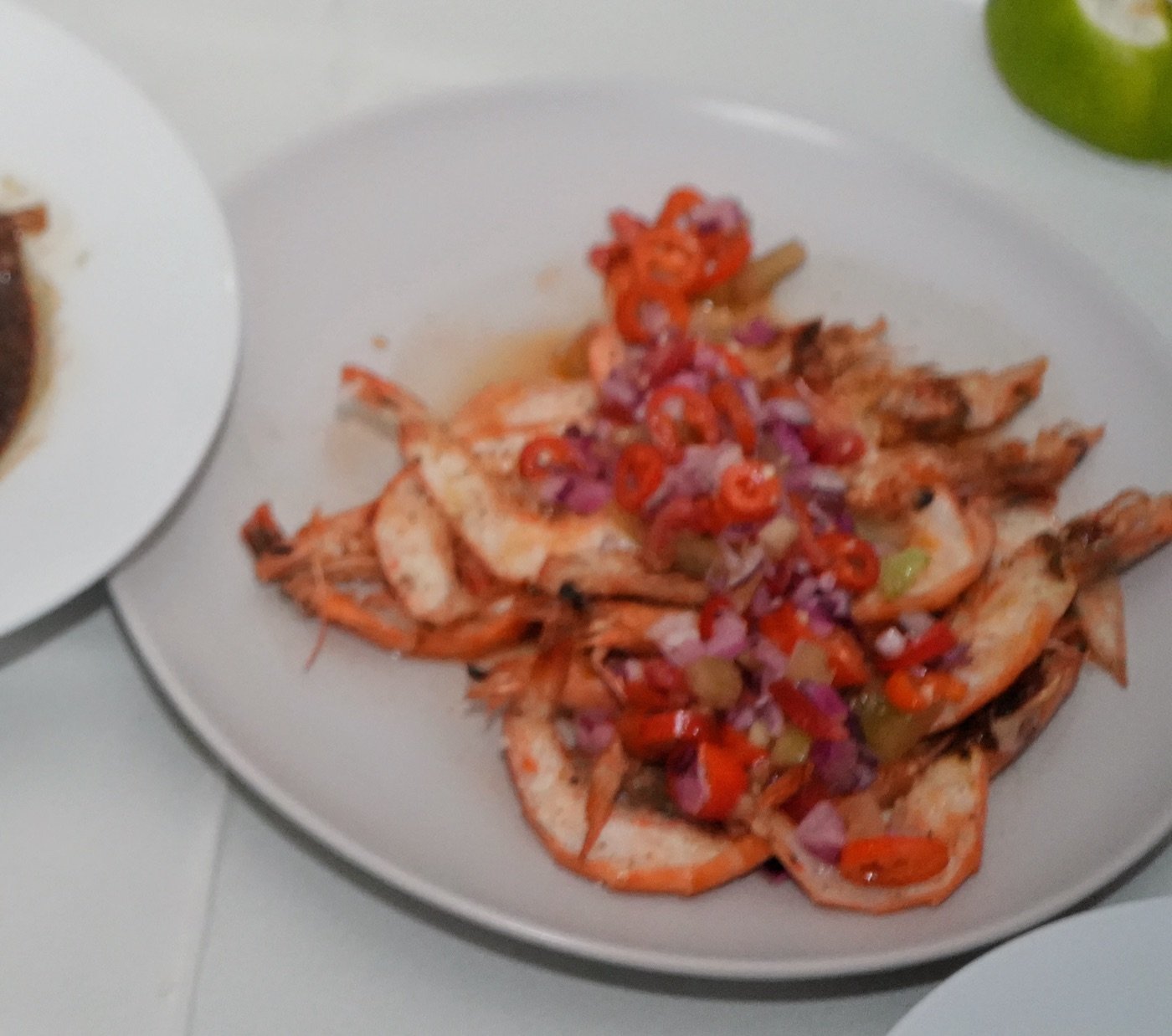 Udang Bakar Dabu-Dabu, grilled prawns topped with bright Manado salsa