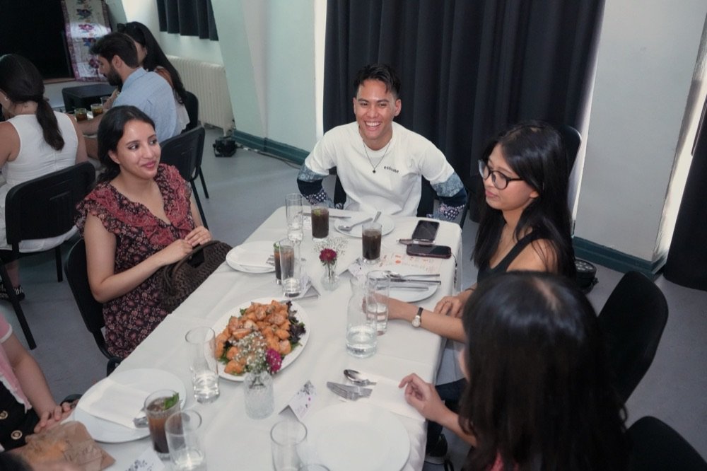 Guests seated together at a long table